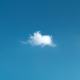 A single white cloud in blue sky